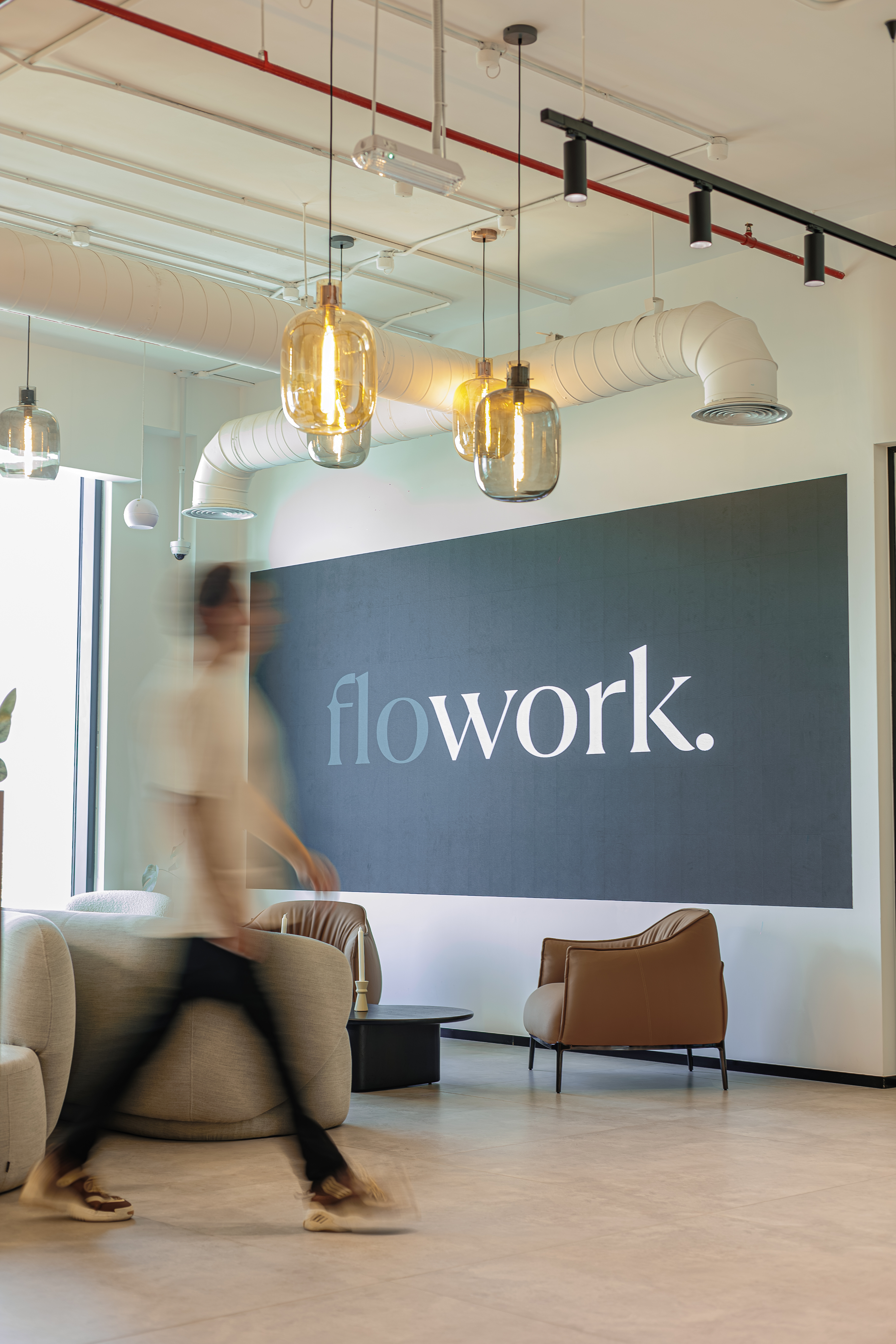 Flowork reception lounge and brand wall